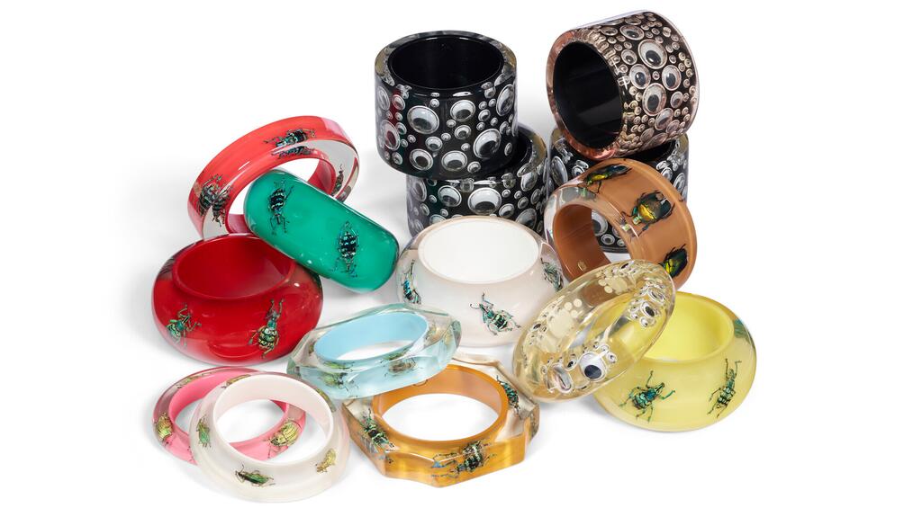 Of the 15 bracelets in lot 14, the googly eyes pieces likely were designed by Apfel for her “Rara Avis,” which means rare bird in Latin, jewelry collection while Kolos Studio likely designed the beetle bangles. (Photo credit: Christie’s) Unapologetically Iris Googly Eyes and Beetle Bangles