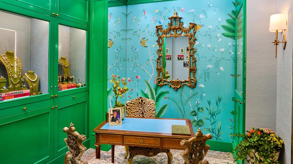 The Beverly Hills boutique features the brand’s trademarked “Kelly Green” gloss lacquer on the cabinetry, an accent wall with teal chinoiserie-inspired wallpaper, and an eclectic curation of furniture. Interior of Margot McKinney Beverly Hills Location
