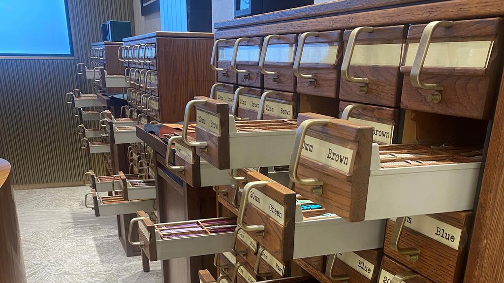 This picture taken by the author shows the vintage card catalog cabinets CD Peacock repurposed to create a watch strap “library,” where people can select from straps in a variety of colors and sizes. CD Peacock watch strap library