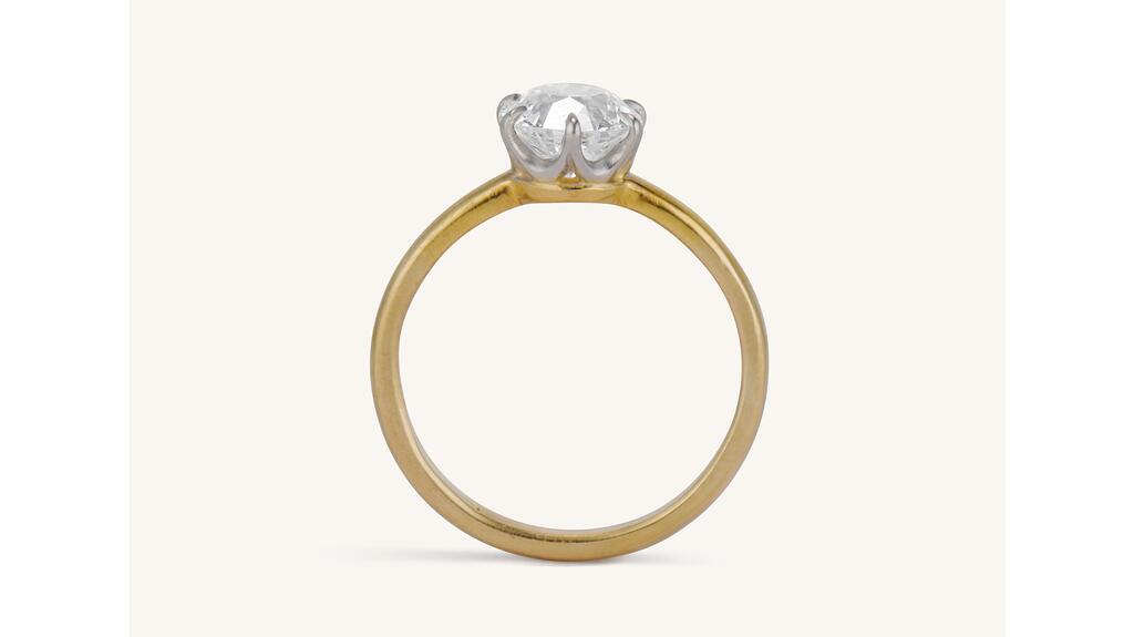 One of the most enduring engagement ring styles of all time, the Tiffany setting is seen in gold with platinum prongs securing a 1.18-carat Old European cut diamond. Tiffany & Co. made this ring in the 1920s. Diamond engagement ring with Tiffany Setting