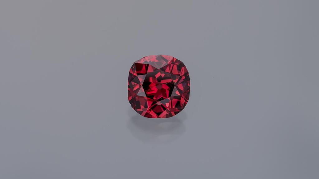 The centerpiece of the Winston Fancy Color Diamond Collection that Ronald Winston donated to the Smithsonian is this 2.33-carat fancy red diamond dubbed the “Winston Red.” (Photo credit: Robert Weldon/Photo courtesy of Ronald Winston) 2.33-carat “Winston Red” diamond