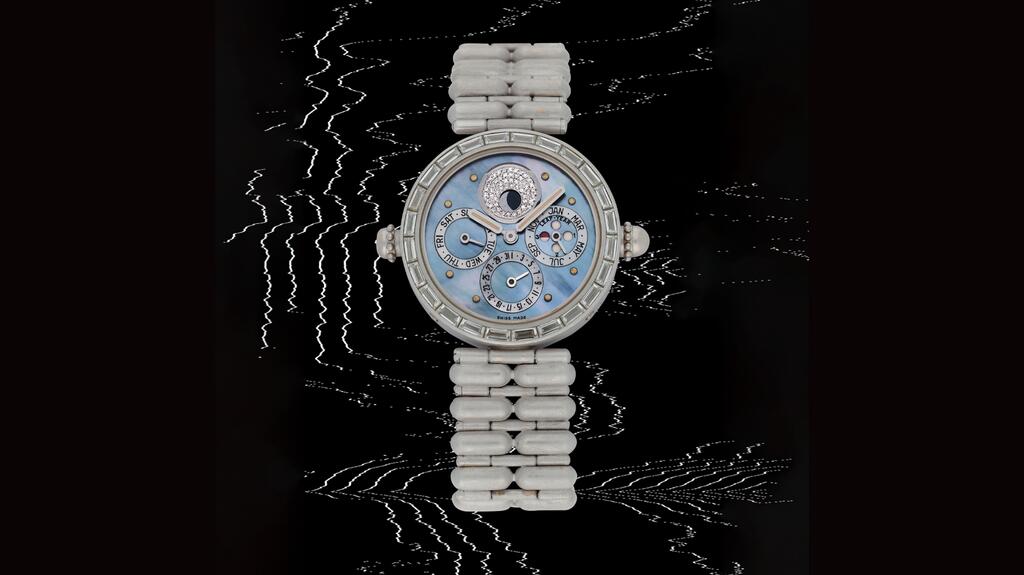 A rare white gold wristwatch by Gérald Genta, circa 1990. The piece is set with diamonds and boasts a mother-of-pearl dial and minute-repeating perpetual calendar with a leap-year indicator (est. 100,000 CHF to 200,000 CHF, or $112,290 to $224,580). Gérald Genta watch 1990