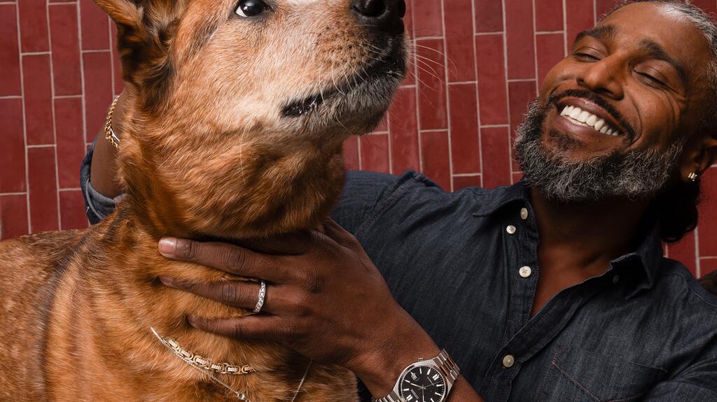 “Jewelry is for every occasion—morning coffee, dog walks, even the gym,” according to Zales Creative Director Lionel Cipriano. Man and dog wearing Zales jewelry