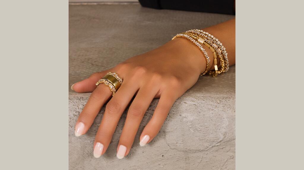The “Milli Icon” ring jacket in 18-karat yellow gold with 2.22 carats of baguette- and round-cut diamonds ($22,000) Suzanne Kalan Milli Icon Smart Ring Jacket
