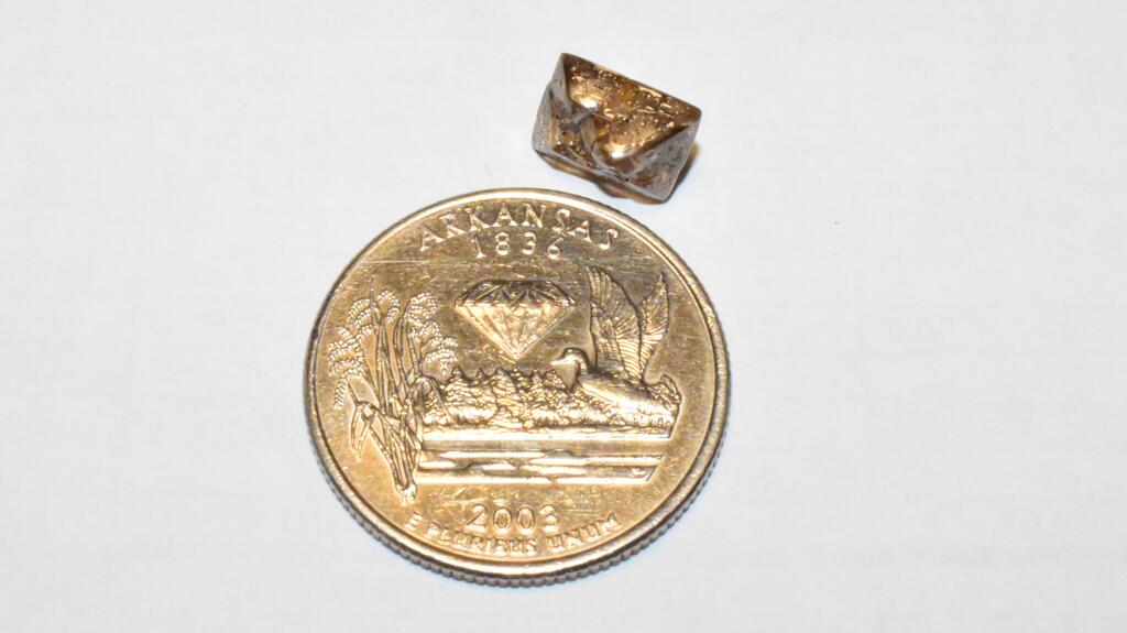 The 3.81-carat Duke Diamond next to a quarter Duke Diamond