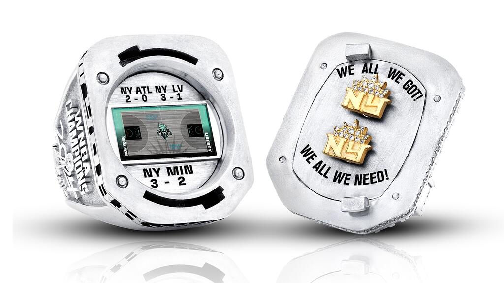 The ring twists open to reveal a pair of gold “NY” earrings depicted with a pavé diamond Liberty crown. NY Liberty 2024 WNBA Championship Ring Earrings