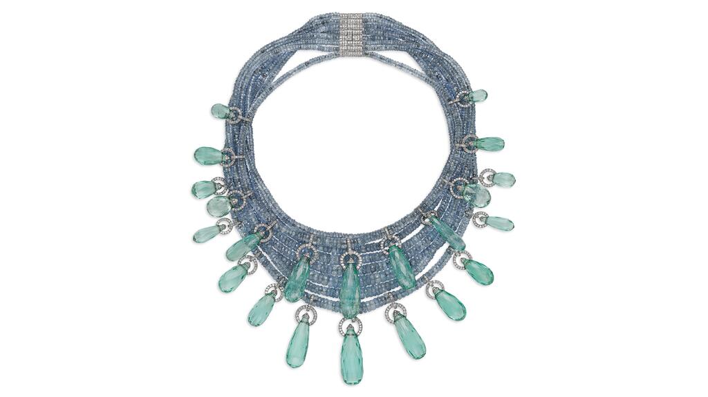 This JAR necklace, circa 1991, from the Anne Bass collection features drop briolette emeralds, faceted sapphire beads, round diamonds, platinum and 18-karat white gold. Jewelry Collection of Anne H. Bass JAR emerald necklace