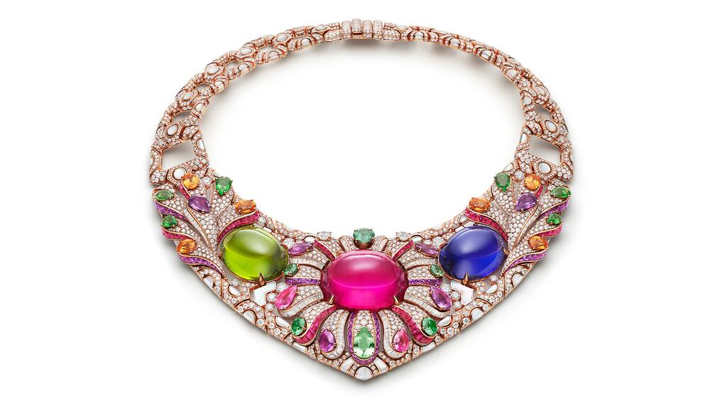 The “Polychromatic Bloom” necklace depicts floral motifs with a 106.36-carat rubellite set inside blossoming petals. It is flanked by a 55.52-carat peridot and a 55.11-carat tanzanite. Bulgari Polychromatic Bloom Necklace