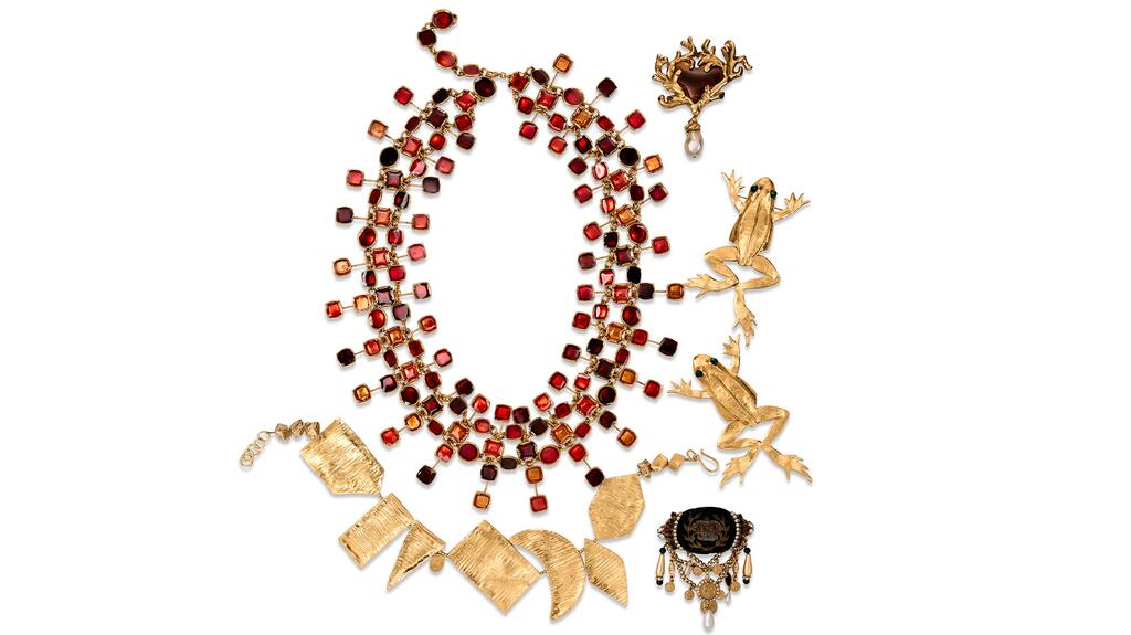 The Christian LaCroix heart brooch, seen top right, and Kenneth Lane frog brooches, middle right, are included in a group of designer costume accessories estimated to fetch $400 to $600. (Photo credit: Christie’s) Unapologetically Iris Designer Costume Heart and Frog Brooches