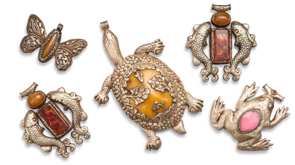 Lot 120 is comprised of animal pendants possibly from China with either stone or resin inlays. (Photo credit: Christie’s) Unapologetically Iris Animal-Shaped Pendants