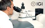 Man at International Gemological Institute microscope