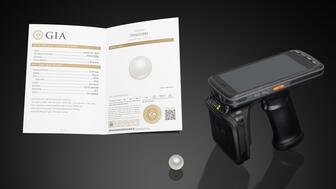 A South Sea cultured pearl containing an RFID tag, an RFID reader, and a GIA Cultured Pearl Classification Report describing the RFID reference number 20240917_GIA pearl header.jpg