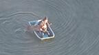 Two people in a rowboat