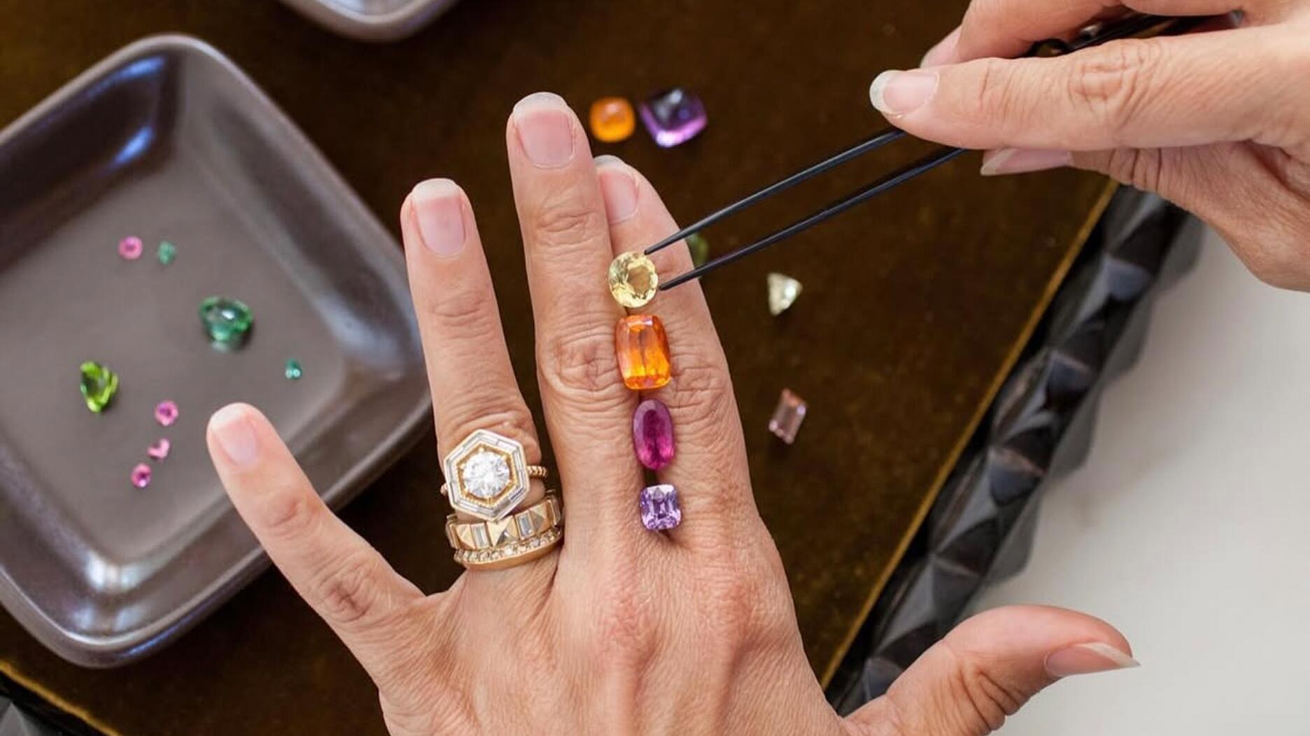 Lauren Harwell Godfrey of Harwell Godfrey, pictured, has been attending the Tucson gem shows since 2016. Jewelry designer Lauren Harwell Godfrey looking at colored gemstones