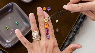 Lauren Harwell Godfrey of Harwell Godfrey, pictured, has been attending the Tucson gem shows since 2016. Jewelry designer Lauren Harwell Godfrey looking at colored gemstones