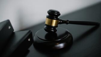 Anthony Farrer, 36, the luxury watch dealer who made a name for himself as “The Timepiece Gentleman,” pleaded guilty to two counts of fraud in late 2024. Last week, a federal judge sentenced him to 70 months in prison. Stock image of a gavel