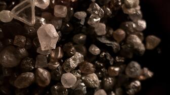 Rough diamonds from Canada’s Gahcho Kué mine. Production at Gahcho Kué fell 43 percent in the fourth quarter and 16 percent on the year, part of a broader decline across all mines De Beers operates. (©De Beers Group/Photo credit: Ben Perry @ Armoury Films) Rough diamonds from De Beers’ Gahcho Kue diamond mine in Canada