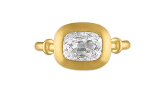 This cushion-cut diamond engagement ring by designer Jean Prounis is one of the rings featured on the cover of “The History of Diamond Engagement Rings: A True Romance” and is a favorite of author Marion Fasel. (Photo courtesy of Marion Fasel) Jean Prounis cushion-cut diamond engagement ring