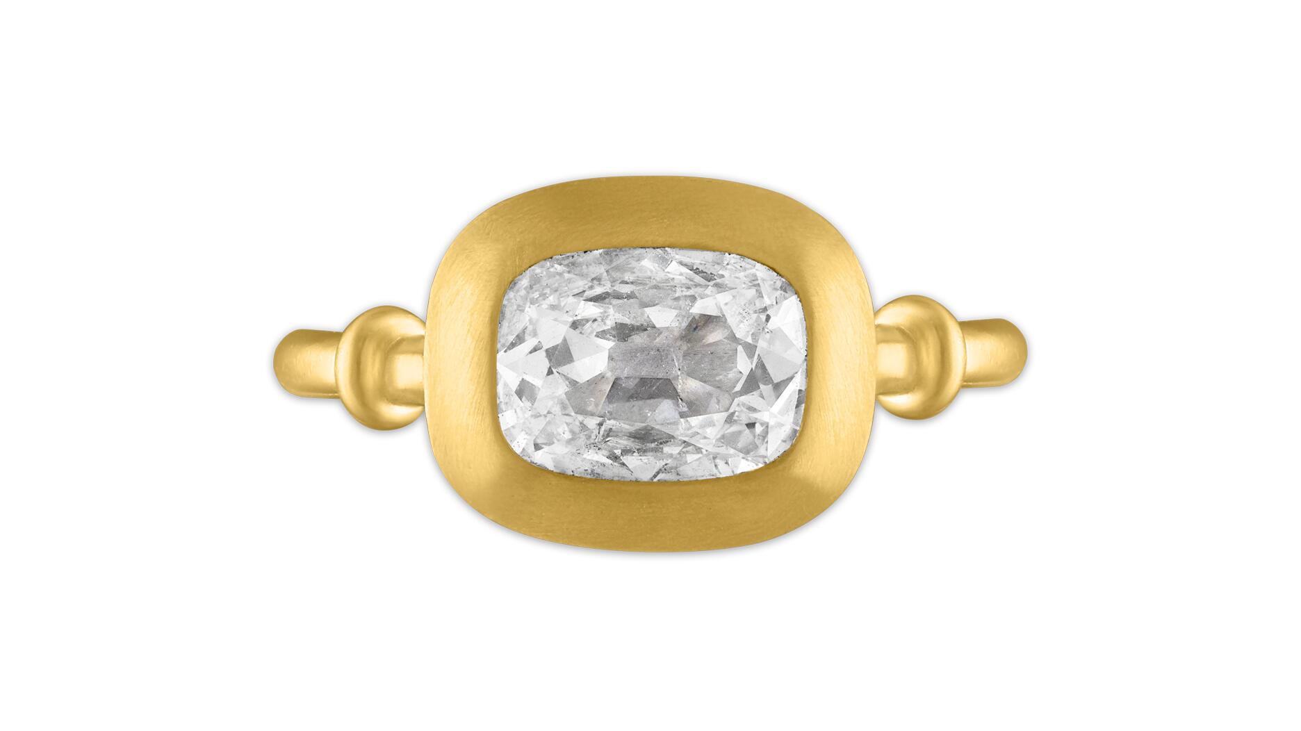 This cushion-cut diamond engagement ring by designer Jean Prounis is one of the rings featured on the cover of “The History of Diamond Engagement Rings: A True Romance” and is a favorite of author Marion Fasel. (Photo courtesy of Marion Fasel) Jean Prounis cushion-cut diamond engagement ring