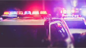 Two men, identified as Dimitriy Nezhinskiy and Juan Villar, who operated a business in New York City’s Diamond District, were charged with running a fencing operation for South American theft groups. Police cars with lights on