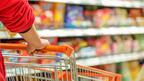 Woman pushing a shopping cart