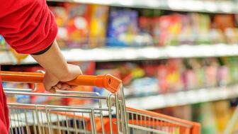 U.S. consumer confidence fell in February as consumers worried about inflation, tariffs, the labor market, and more. Woman pushing a shopping cart