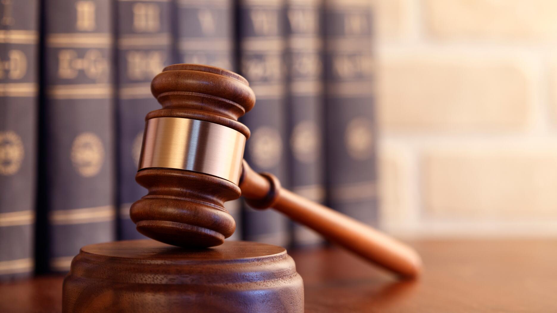 Manashe Sezanayev of Queens, New York, who was accused of replacing three natural diamonds with lab-grown ones, has pleaded guilty to defrauding two diamond merchants. Stock image of a gavel