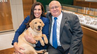 Jewelers Dan and Hope Wixon, pictured with one of the two Labrador retrievers who comes to work with them, are heading into retirement. Their store, Wixon Jewelers, will close in May. Dan and Hope Wixon with dog