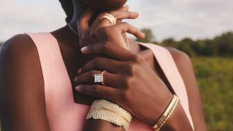 A model wears Brilliant Earth jewelry, including pieces from its collaboration with Jane Goodall. The jewelry company posted declining sales in its recent financial results. Woman wearing Brilliant Earth jewelry