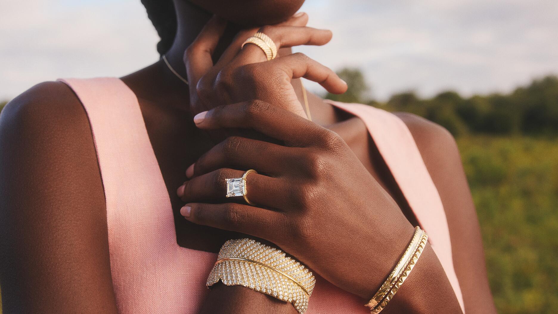 A model wears Brilliant Earth jewelry, including pieces from its collaboration with Jane Goodall. The jewelry company posted declining sales in its recent financial results. Woman wearing Brilliant Earth jewelry