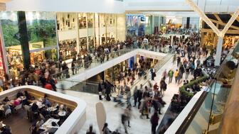 The National Retail Federation outlined its forecast for 2025 as consumers continue to face inflation and instability. Stock image of people shopping in a mall
