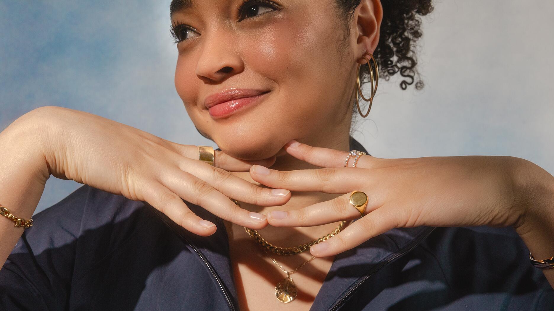 Zales launched the “Own It” campaign as part of its rebrand, encouraging shoppers to wear fine jewelry for any occasion. Woman wearing Zales jewelry