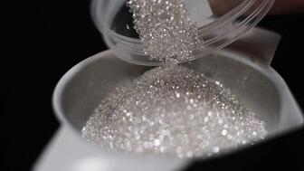 De Beers Group reported Thursday that its production was down 11 percent year-over-year in the first quarter of 2025 while rough diamond revenue dropped 44 percent year-over-year. (Photo courtesy of De Beers Group) Melee diamonds from De Beers