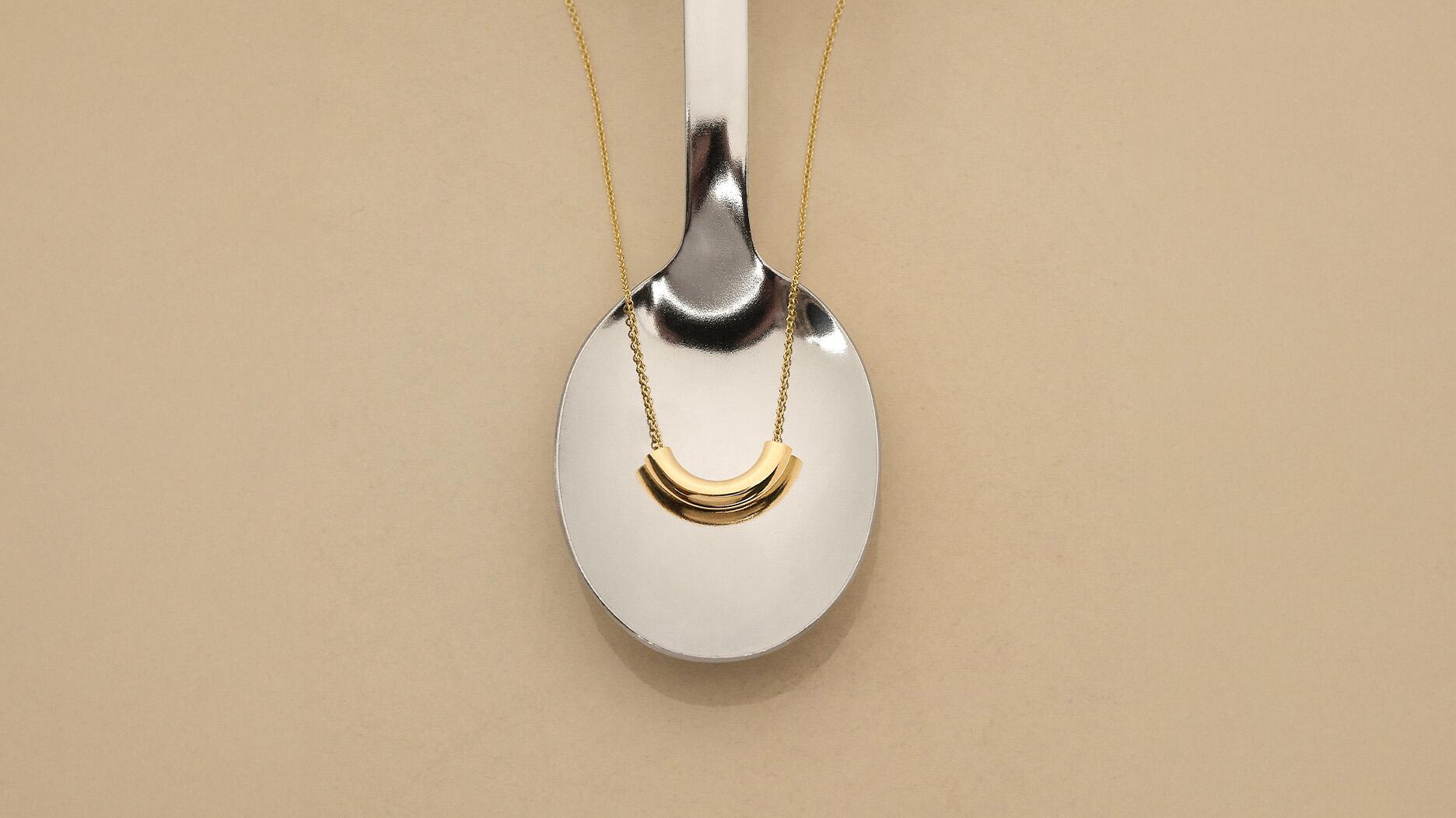 Designed as a Mother’s Day gift, the “Forever Macaroni” necklace features a single 14-karat yellow gold macaroni noodle strung on a chain ($25). Kraft Mac & Cheese x Ring Concierge Forever Macaroni Necklace