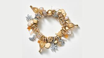 This Pandora bracelet features charms that are part of a collection curated by Tyla, a Pandora brand ambassador and Grammy-winning singer. The company posted strong first-quarter results, with global sales up 7 percent on an organic basis. Pandora gold and silver charm bracelet